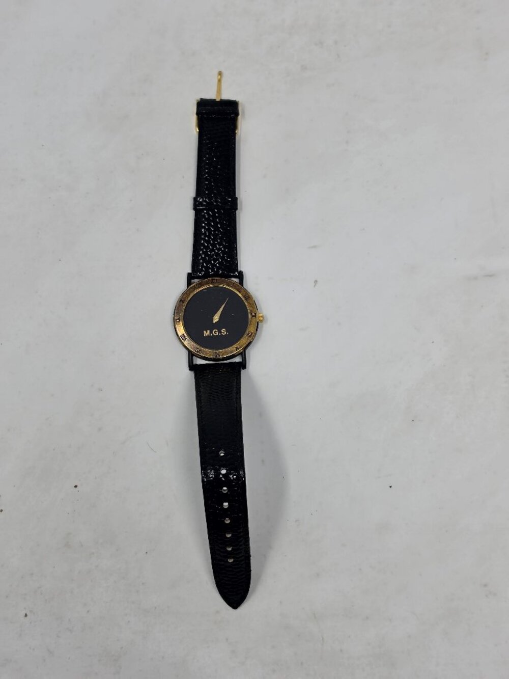M.G.S. Quartz Wristwatch Black Dial Gold Tone Case Genuine Leather Strap